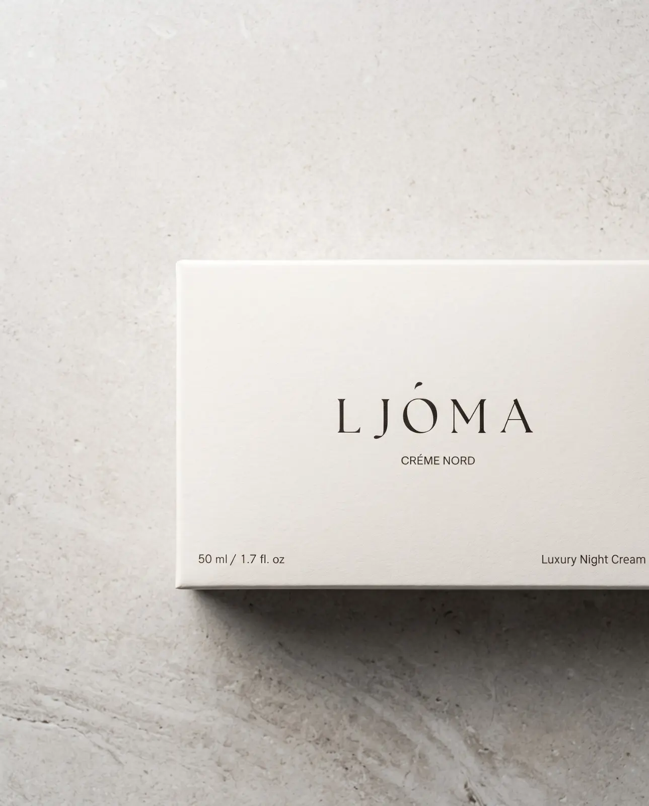 Ljóma Crème Nord outer carton photographed on grey stone