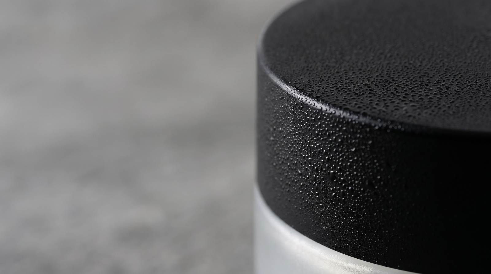 Macro detail of the Ljóma jar lid covered in fine condensation